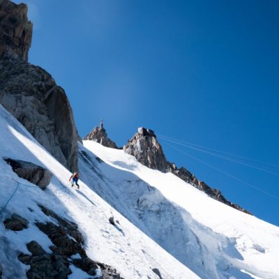 Mihnea on steep snow near the top of the Frendo Spur.